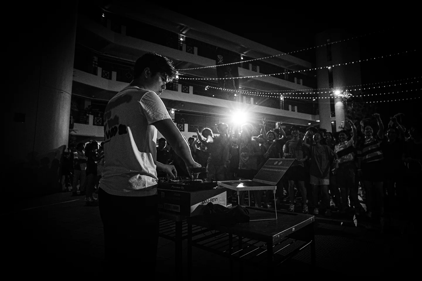 A musician performing at an outdoor night event